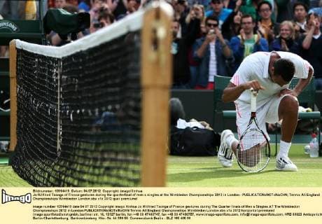 Jo-Wilfried Tsonga of France gestures during the quarterfinal of men s singles at the Wimbledon Championships 2012 in London - 