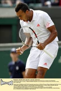 Jo-Wilfried Tsonga of France celebrates one point during the quarterfinal of men s singles at the Wimbledon Championships 2012 in London - 