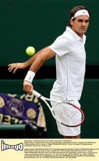 Roger Federer of Switzerland returns the ball during the quarterfinal of men s singles at the Wimbledon Championships 2012 in London - 