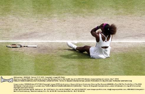 America s Serena Williams celebrates winning the Womens final on the twelth day of the 2012 Wimbledon championships in London, July 7, 2012.  LON2012070703