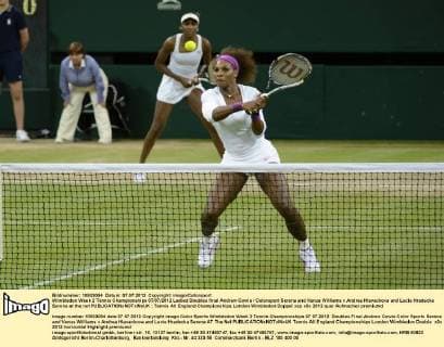 Wimbledon Week 2 Tennis Championships 07 07 2012 Ladied Doubles final Andrew Cowie Colorsport Serena and Venus Williams v Andrea Hlavackova and Lucie Hradecka Serena at the net 