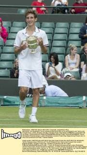 08.07.2012. The Wimbledon Tennis Championships 2012 held at The All England Lawn Tennis and Croquet Club, London, England, UK. Boy s Singles Finals. Filip Peliwo (CANADA) is presented with his trophy. xDuncanxGrovex  ActionPlus20255343