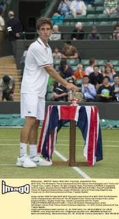 08.07.2012. The Wimbledon Tennis Championships 2012 held at The All England Lawn Tennis and Croquet Club, London, England, UK. Boy s Singles Finals. Filip Peliwo (CANADA) is presented with his trophy. xDuncanxGrovex  ActionPlus20255344