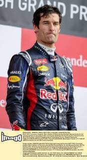08.07.2012 Towcester, England. Mark Webber of Australia and Red Bull Racing stands for his national anthem on the podium after winning the Santander British Grand Prix, Round 9 of the 2012 FIA Formula 1 World Championship at Silverstone Circuit. xRoganxThomsonx  ActionPlus20255449