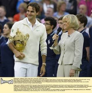08.07.2012. The All England Lawn Tennis and Croquet Club. London, England. Roger Federer of Switzerland celebrating with the trophy after winning the match during mens singles finals at Wimbledon Tennis Championships at The All England Lawn Tennis and Croquet Club. London, England, UK xNigelxWaldronx  ActionPlus20255770