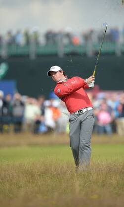 Northern Ireland s Rory McIlroy ( Mc Ilroy ) hits out of the rough on the 4th hole on the second round of The 2012 Open Championship in Lytham St Annes, July 20, 2012.  LON2012072015