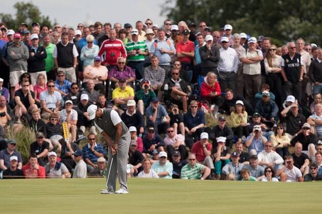 Golf - The Open - Day Three Tiger Woods of USA putts in front of a bank of spectators on the 3rd green at Royal Lytham & St Anne s Golf Club 