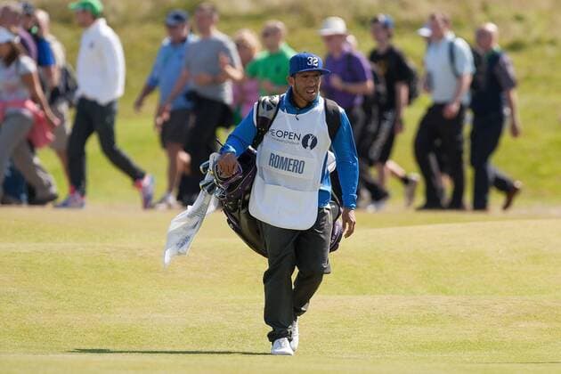 Golf - The Open - Day Four Carlos Tevez of Manchester City acts as caddie for Andres Romero of Argentina at Royal Lytham & St Anne s Golf Club 