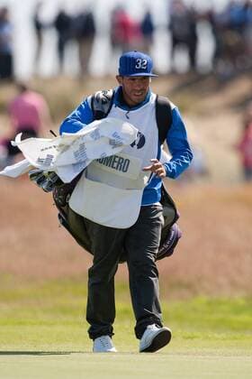Golf - The Open - Day Four Carlos Tevez of Manchester City acts as caddie for Andres Romero of Argentina at Royal Lytham & St Anne s Golf Club 