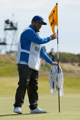 Golf - The Open - Day Four Carlos Tevez of Manchester City acts as caddie for Andres Romero of Argentina at Royal Lytham & St Anne s Golf Club 