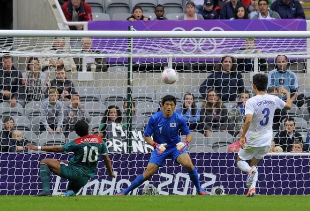 Mexico s Giovani dos Santos (L) puts his shot narrowly wide of South Korea s goal..London Olympic 2012 first round Group B men s match between Mexico v South Korea at the St. James Park, Newcastle upon Tyne on the 26th July 2012. Pic Richard Lee SPORTIMAGE... EDITORIAL USE ONLY. No use with unauthorised audio, video, data, fixture lists, club league logos or live services. Online in-match use limited to 120 images, no video emulation. No use in betting, games or single club league player publications.