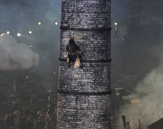 Performer climbs a chimney during a segment on The Age of Industry during the Opening Ceremony at the London 2012 Summer Olympic Games on July 27, 2012 in London.  OLY20120727308