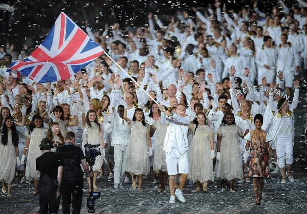 Olympics - London 2012 - Opening Ceremony Sir Chris Hoy carries the Union flag into the Olympic Stadium in front of the Great Britain team 