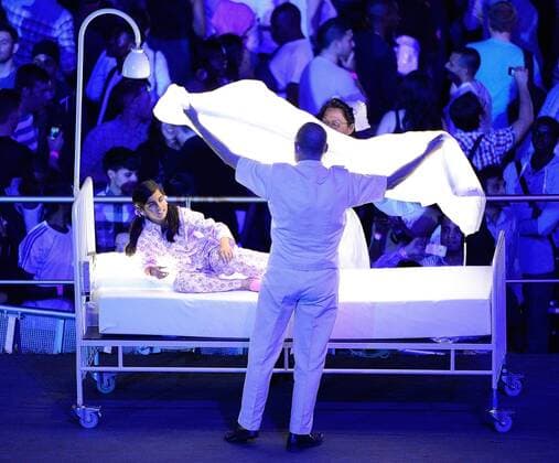 July 27, 2012 - London, GBR - A child and an actor dressed as an medical assistan perform during the Opening Ceremony at the Olympic Stadium in London, England, during the 2012 Summer Olympic Games, Friday, July 27, 2012. 2012 Summer Olympics Opening Ceremony - ZUMAm67