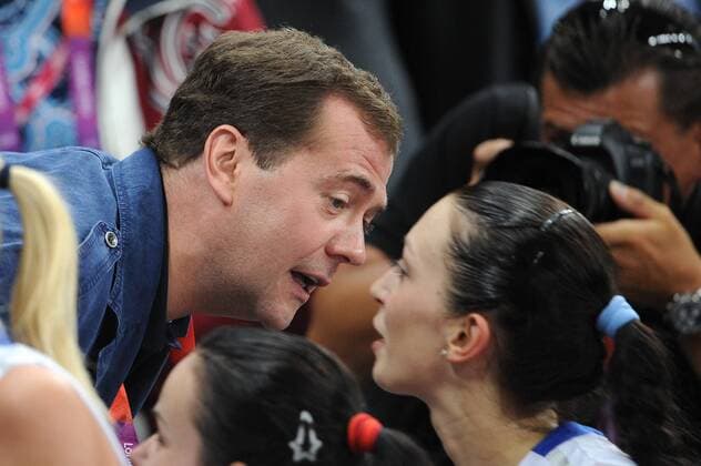LONDON, GREAT BRITAIN. JULY 28, 2012. Russian Prime Minister Dmitry Medvedev congratulates player Evgeniya Startseva after the women s volleyball game Russia vs. Great Britain at the London 2012 Olympic Games.  premiumd RE10416D
