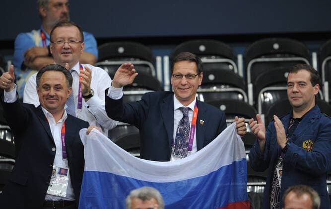 LONDON, GREAT BRITAIN. JULY 28, 2012. Russian Minister of Sport, Youth and Tourism, Vitaly Mutko, President of the Russian Olympic Committee (ROC), Alexander Zhukov and Russian Prime Minister Dmitry Medvedev (L-R) attend the women s volleyball game Russia 3 -1 Great Britain at the London 2012 Olympic Games.  premiumd RE10417E