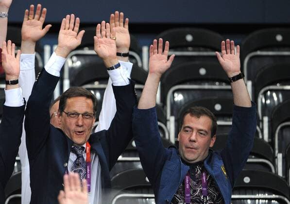 LONDON, GREAT BRITAIN. JULY 28, 2012. President of the Russian Olympic Committee (ROC), Alexander Zhukov (L) and Russian Prime Minister Dmitry Medvedev attend the women s volleyball game Russia vs. Great Britain at the London 2012 Olympic Games.  premiumd RE104186