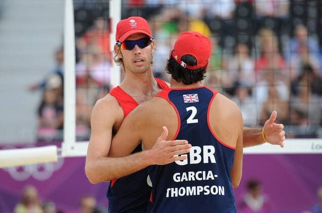 Olympics - London 2012 - Beach Volleyball - GBR vs CAN Steve Gratowski (GB) hugs team mate John Garcia-Thompson (GB) during their preliminary round at Horse Guards Parade, London 
