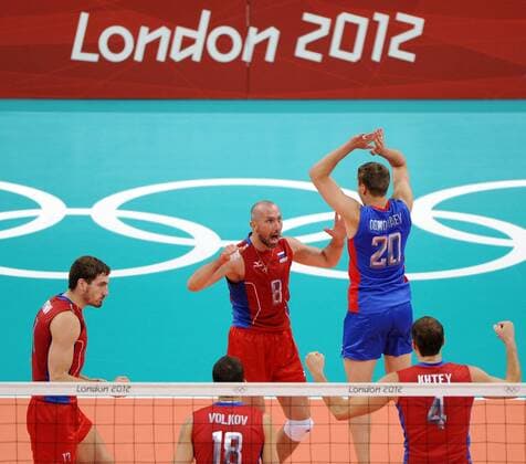 .Alexey Obmochaev (No.20) of Russia celebrates with teammates during men s volleyball preliminary pool B match between Russia and Germany at London 2012 Olympic Games in London, Britain, on July 29, 2012. Russia won 3-0. (Xinhua Li Gang) (nxl) (OLY2012)BRITAIN-LONDON-VOLLEYBALL-MEN 
