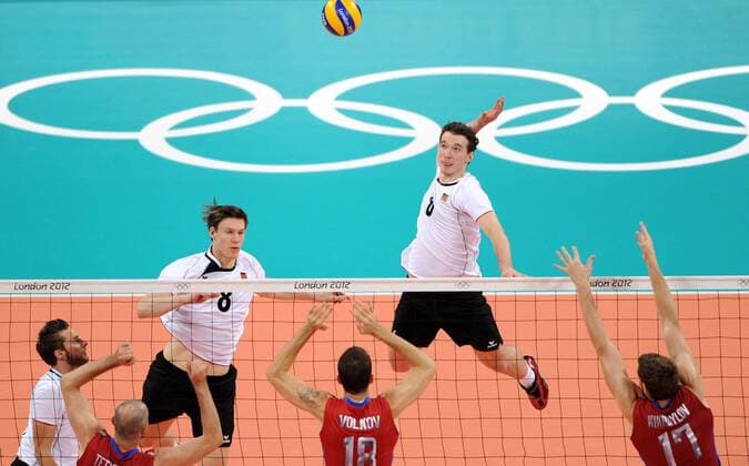 .Denys Kaliberda (R) of Germany competes during men s volleyball preliminary pool B match between Russia and Germany at London 2012 Olympic Games in London, Britain, on July 29, 2012. Russia won 3-0. (Xinhua Li Gang) (nxl) (OLY2012)BRITAIN-LONDON-VOLLEYBALL-MEN 