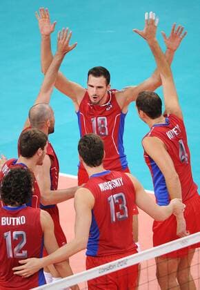 ITAR-TASS: LONDON, UK. JULY 29, 2012. Russia s Alexander Volkov (C background), Alexander Butko, Dmitry Musersky, Taras Khtei (L-R front) react during a preliminary round group B men s volleyball match against Germany at London 2012 Summer Olympic Games, at Earls Court. Russia won the game 3:0.  premiumd Highlight RE104306