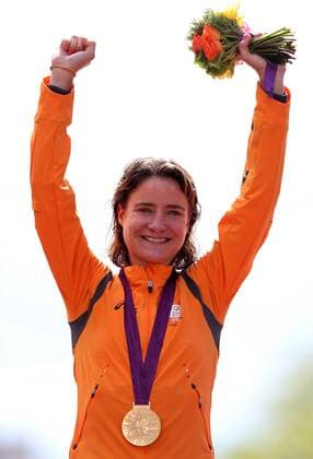 .Marianne Vos of the Netherlands celebrates at the awarding ceremony of the women s road race event of cycling at the London 2012 Olympic Games in London, Britain, July 29, 2012. Vos claimed the title in this event with 3:35:29. (Xinhua Wang Lili) (zgp) (OLY2012)BRITAIN-LONDON-WOMEN S ROAD RACE-GOLD 