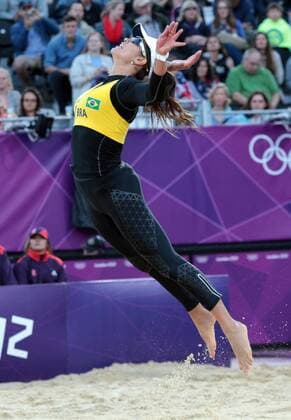 Brazil s Talita Rocha flies through the air in her Women s Beach Volleyball match against Holland at the London 2012 Summer Olympics on July 29, 2012 in London.  OLY20120729619