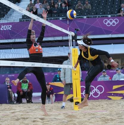 Brazil s Maria Antonelli smashes the ball towards Holland s Madelein Meppelink in their Women s Beach Volleyball at the London 2012 Summer Olympics on July 29, 2012 in London.  OLY20120729618