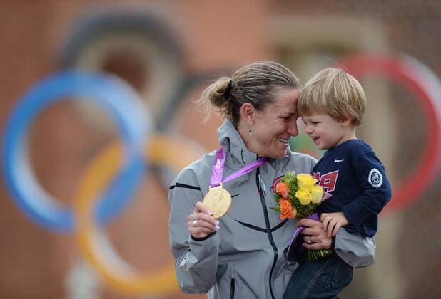Goldmedalist Kristin Armstrong of the United States (USA) holds her son Lucas William Savola during victory ceremony of women s Cycling Road individual time trial contest, at London 2012 Olympic Games in London, Britain, on August 1, 2012. 