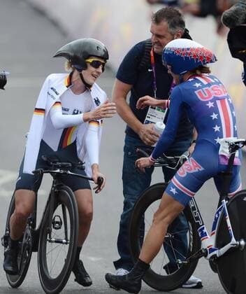 (120801) -- LONDON, Aug. 1, 2012 (Xinhua) -- Gold medalist Kristin Armstrong of the United States (R) interacts with silver medalist Judith Arndt of Germany after women s Cycling Road individual time trial contest, at London 2012 Olympic Games in London, Britain, on August 1, 2012. (Xinhua Li Ga) (nxl) (OLY2012)BRITAIN-LONDON-ROAD CYCLING-WOMEN S INDIVIDUAL TIME TRIAL 