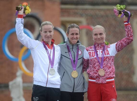 LONDON, Aug. 1, 2012 -- goldmedalist Kristin Armstrong of the United States (USA) (C), silvermedalist Judith Arndt of Germany (L) and Bronzemedalist Olga Zabelinskaya of Russa celebrate during victory ceremony of women s Cycling Road individual time trial contest, at London 2012 Olympic Games in London, Britain, on August 1, 2012. (Xinhua Li Ga) (nxl) (OLY2012)BRITAIN-LONDON-ROAD CYCLING-WOMEN S INDIVIDUAL TIME TRIAL 