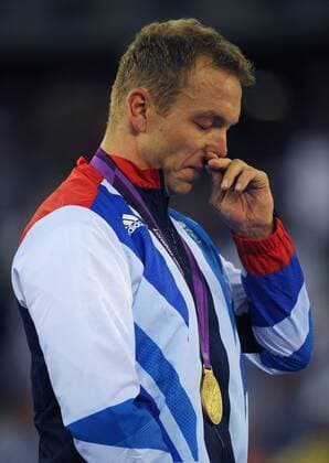Olympics - London 2012 - Track Cycling Sir Chris Hoy (GBR) sheds a tear as he stands for the national anthem having won his 5th Olympic gold, in the Men s Team Sprint (Teamsprint) at the Olympic Velodrome, London 