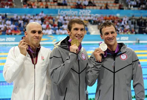 LONDON, Aug. 2, 2012 - Gold medalist Michael Phelps (C) of USA, silver medalist Ryan Lochte (R) of USA and bronze medalist Laszlo Cseh of Hungary pose at awarding ceremony of men s 200m individual medley of swimming, at London 2012 Olympic Games in London, Britain, August 2, 2012. Michael Phelps of USA won gold medal. LONDON-SWIMMING-MEN¡¯S 200M INDIVIDUAL MEDLEY-AWARDING 