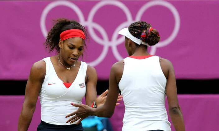 LONDON, Aug. 5, 2012 - Venus and Serena Williams celebrate after winning in women s tennis doubles match, at London 2012 Olympic Games in London, Britain, on August 5, 2012. 