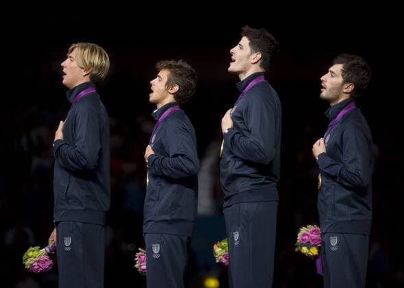 Valerio ASPROMONTE, Giorgio AVOLA, Andrea BALDINI, Andrea CASSARA (alle ITA vlnr) waehrend der Siegerehrung. 10.Wettkampftag: Herren Florett Team Finale Italien im ExCel Center am 05.08.2012. Olympische Sommerspiele London 2012. -- Olympic Summer Games London 2012,