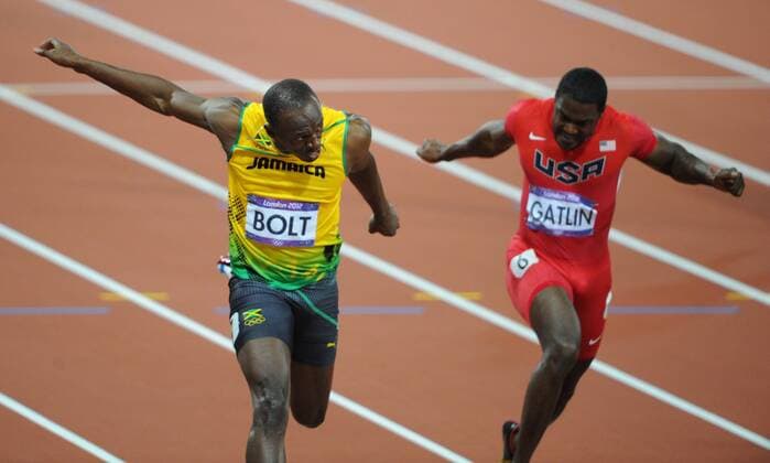 ITAR-TASS: LONDON, GREAT BRITAIN. AUGUST 5, 2012. Jamaica s Usain Bolt (L), fastest man in the world, runs to win goldmedal next to Justin Gatlin in the men s 100m final at the London 2012 Olympic Games, at the Olympic Stadium.  20182087