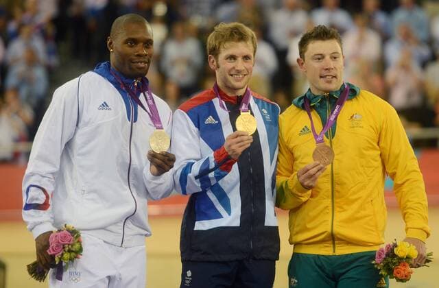 Gold medalist Jason Kenny (C) of Britain, silver medalist Gregory Bauge (L) of France, and bronze medalist Shane Perkins of Australia pose at awarding ceremony of men s sprint of cycling event, at London 2012 Olympic Games, London - 