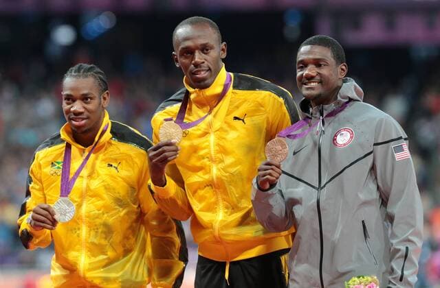 Jamaica s Yohan Blake,Usain Bolt and America s Justin Gatlin at the 100m medal ceremony in the Olympic stadium London 2012 Summer Olympics on August 6, 2012 in London.  OLY20120806631
