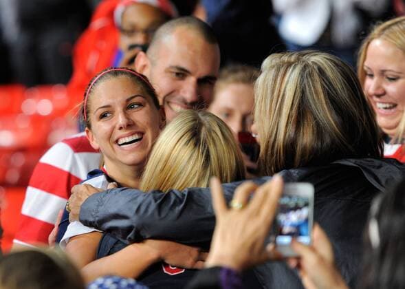Winning goalscorer USA Alex Morgan celebrates with family at the end of the match.CanadavUSA Olympic 2012 semi-final women s match at Old Trafford, Manchester United Kingdom on the 6th August 2012.. EDITORIAL USE ONLY. No use with unauthorised audio, video, data, fixture lists, club league logos or live services. Online in-match use limited to 120 images, no video emulation. No use in betting, games or single club league player publications.