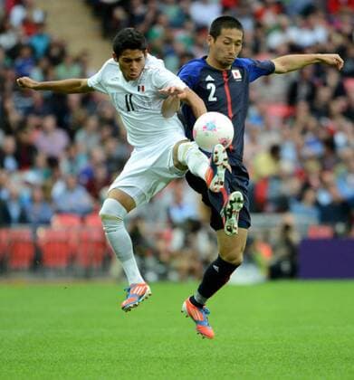LONDON, Aug. 7, 2012 - Javier Aquino (MEX, L) and Yuhei Tokunaga (JPN) compete during men s football semifinal match between Mexico and Japan, at London 2012 Olympic Games in London, Britain, on August 7, 2012. Mexico won 3-1. (OLY2012)BRITAIN-LONDON-FOOTBALL-MEN 