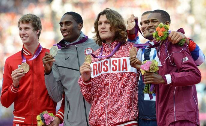 LONDON, Aug. 8, 2012 - Gold medalist Ivan Ukhov of Russia (C), silver medalist Erik Kynard of USA (2nd L), bronze medalists Mutaz Essa Barshim of Qatar (1st R), Derek Drouin of Canada (1st L) and Robert Grabarz of Britain attend victory ceremony of men s High Jump competition, at London 2012 Olympic Games in London, Britain, on August 8, 2012. (OLY2012)BRITAIN-LONDON-ATHLETICS-MEN S HIGH JUMP 