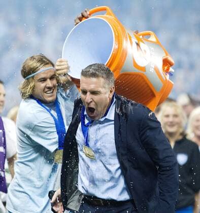 Aug. 8, 2012 - Kansas City, KS, USA - Sporting KC Chance Myers empties the Gatorade onto coach Peter Vermes defeating the Seattle Sounders FC during Wednesday s Lamar Hunt US Open Cup soccer championship on August 8, 2012, at Livestrong Sporting Park in Kansas City, Kansas. Sporting KC vs. Seattle Sounders - ZUMAm67