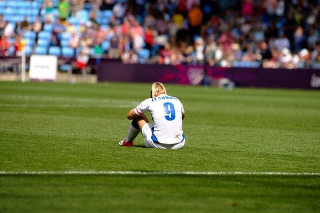 09.08.2012 Coventry, England. Eugenie le SOMMER (France) sits forlorn after Rhian WILKINSON (Canada) scored the winning goal during the Olympic Football Women s Bronze match play-off game between France and Canada from the City of Coventry Stadium xAnthonyxStanleyx  ActionPlus11314548