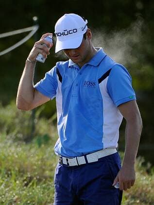 Martin Kaymer of Germany sprays himself with sunscreen and walks to the tee box on hole 10 during the first round of the PGA Golf Herren Championship on August 9, 2012 at the Ocean Course in Kiawah Island, South, Carolina.  SCP20120809103
