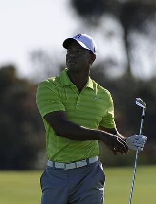 Tiger Woods uses his fairway iron from hole 11 during the first round of the PGA Golf Herren Championship on August 9, 2012 at the Ocean Course in Kiawah Island, South, Carolina.  SCP20120809109