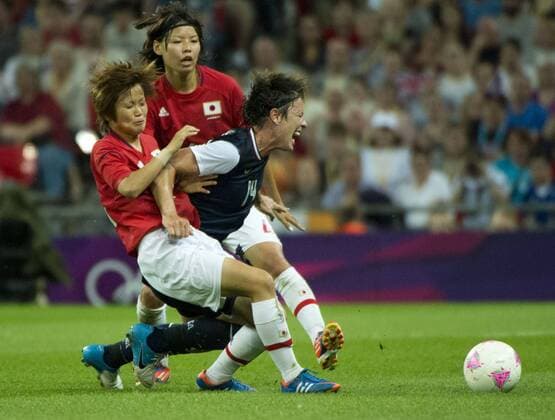 Aug. 9, 2012 - London, England, United Kingdom - ABBY WAMBACH goes against Japan players during the women s soccer gold medal match between the United States (USA) and Japan at London 2012 Olympic Games at Wembley Stadium. Olympics 2012 - Soccer - USA Defeats Japan 2-1 to Win Gold - ZUMAj89
