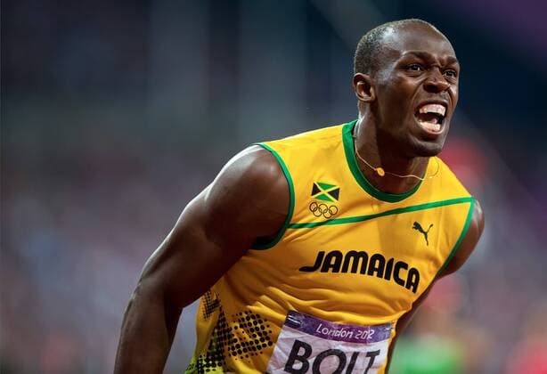 May 20, 2012 - London, GBR - Usain Bolt of Jamaica, left, celebrated after winning the gold medal in the men s 200m final in a time of 19.32 at Olympic Stadium during the 2012 Summer Olympic Games in London, England, Thursday, August 9, 2012. 2012 Summer Olympics Men s 200 - ZUMAm67