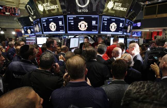 Co-chairmen Avram and Joel Glazer stand on the floor of the New York Stock Exchange right before Manchester United Lists its Initial Public Offering at the NYSE on Wall Street In New York City on August 10, 2012. Manchester United will begin trading today on the NYSE under the ticker symbol MANU.  NYP20120810110