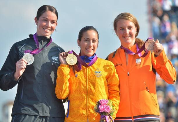 LONDON, Aug. 10, 2012 - Gold medalist Mariana Pajon of Colombia (C), silver medalist Sarah Walker of New Zealand (L) and bronze medalist Laura Smulders of the Netherlands attend victory ceremony of women s cycling BMX competition, at London 2012 Olympic Games in London, Britain, on August 10, 2012. (OLY2012)BRITAIN-LONDON-CYCLING BMX-WOMEN S BMX 