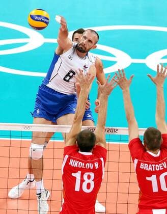 LONDON, Aug. 10, 2012 - Sergey Tetyukhin (back) of Russia smashes during men s volleyball semifinal between Russia and Bulgaria at London 2012 Olympic Games, London, Britain, Aug. 10, 2012. Russia won the match 3-1. (OLY2012)BRITAIN-LONDON-MEN S VOLLEYBALL-SEMIFINAL 